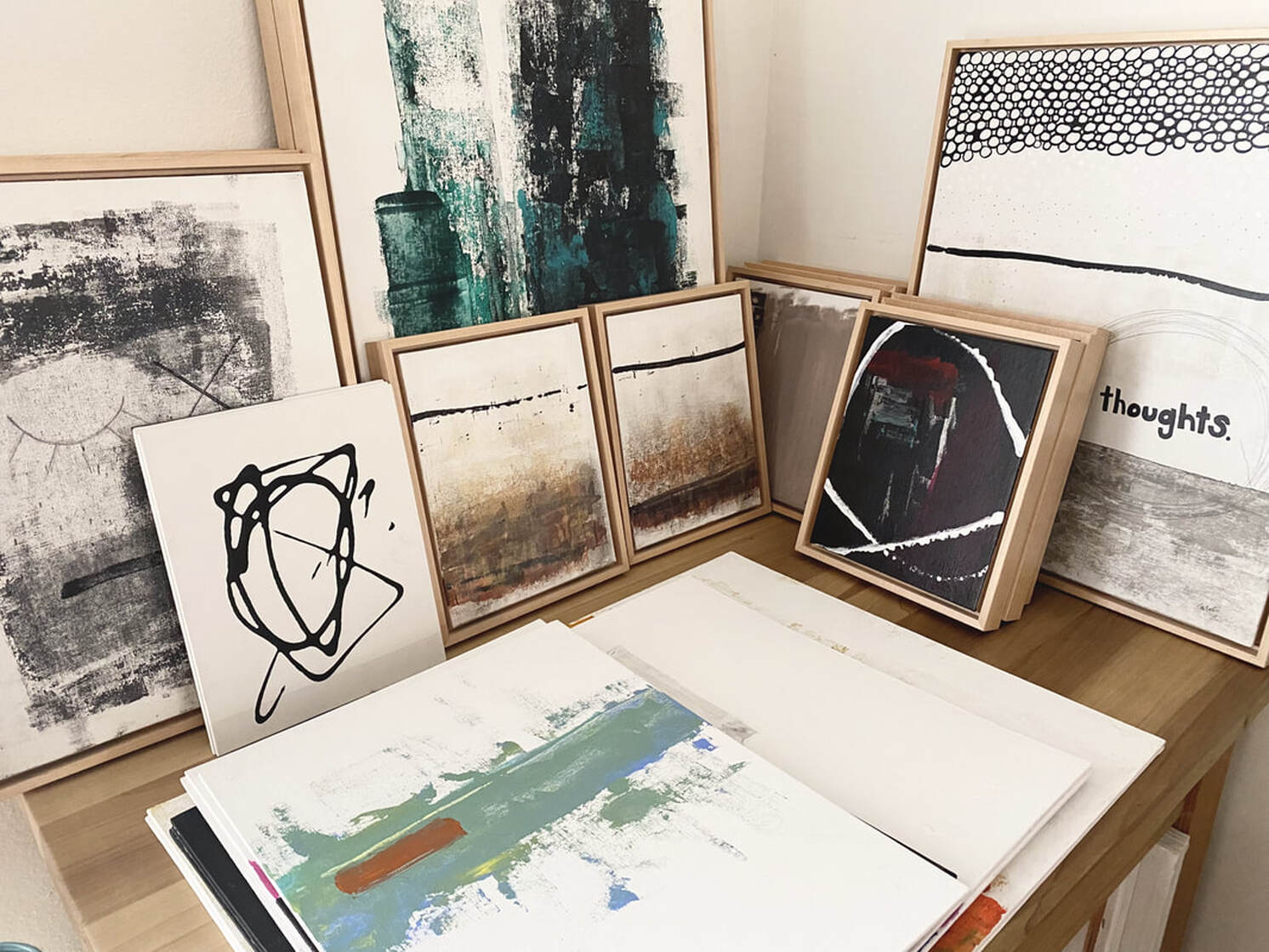 group of original abstract paintings by Tobi Beck in her studio